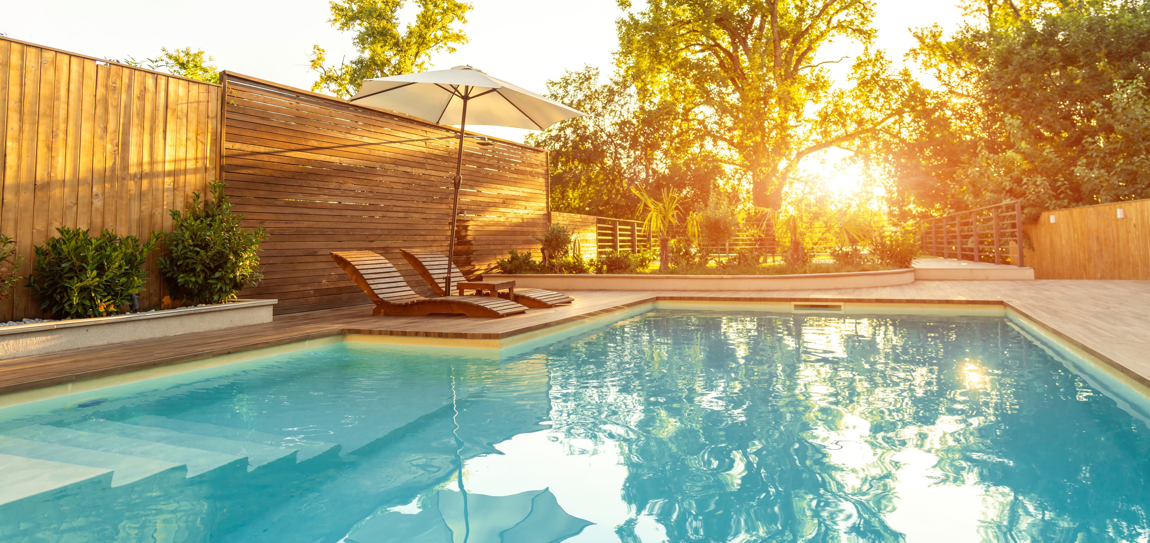 Swimming pool and wooden terrace prepared for an owner's arrival